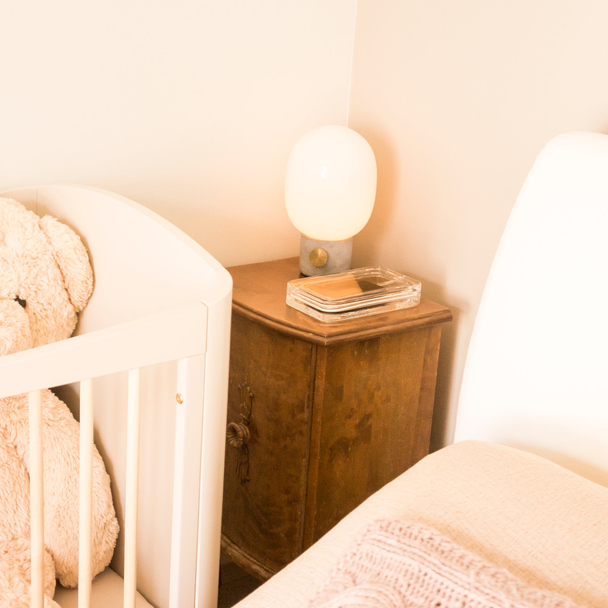 Elegant glass phone charging case on bedside table