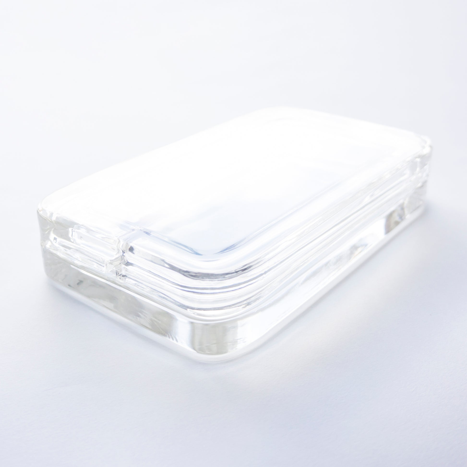 Varjelus Gen1 glass phone charging box light reflecting from top