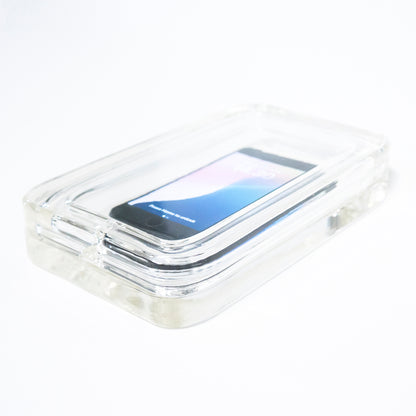 Varjelus glass box housing an iphone SE